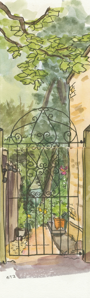 iron gate and garden beyond